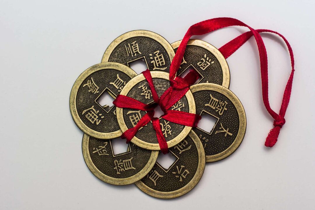 Chinese amulet for money with corresponding hieroglyphs