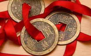 Chinese coins, tied with a red ribbon